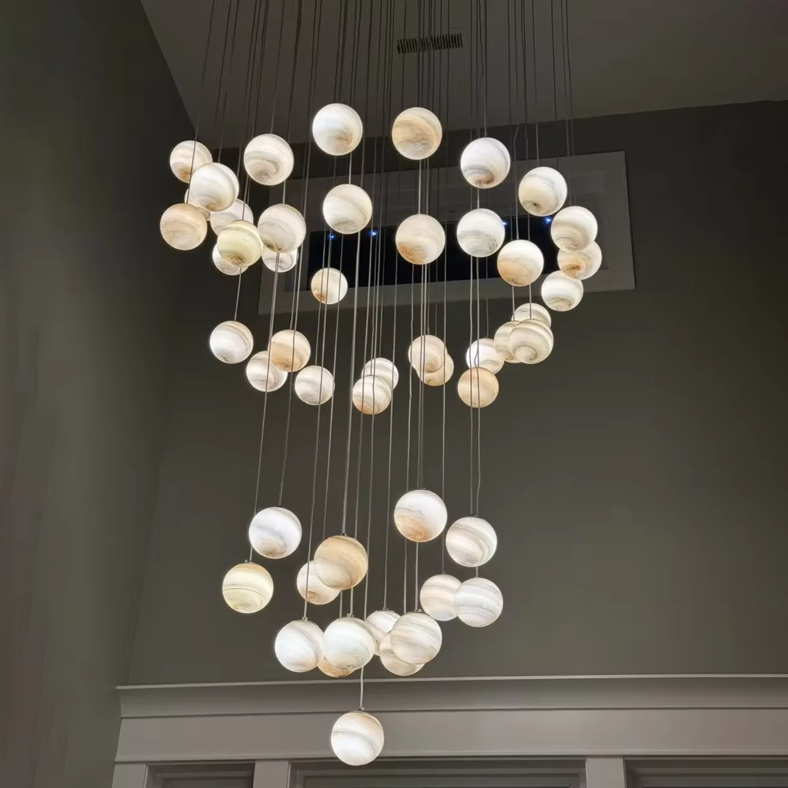 Custom-designed multi-hanging spherical chandeliers, suitable for double-height foyer project view