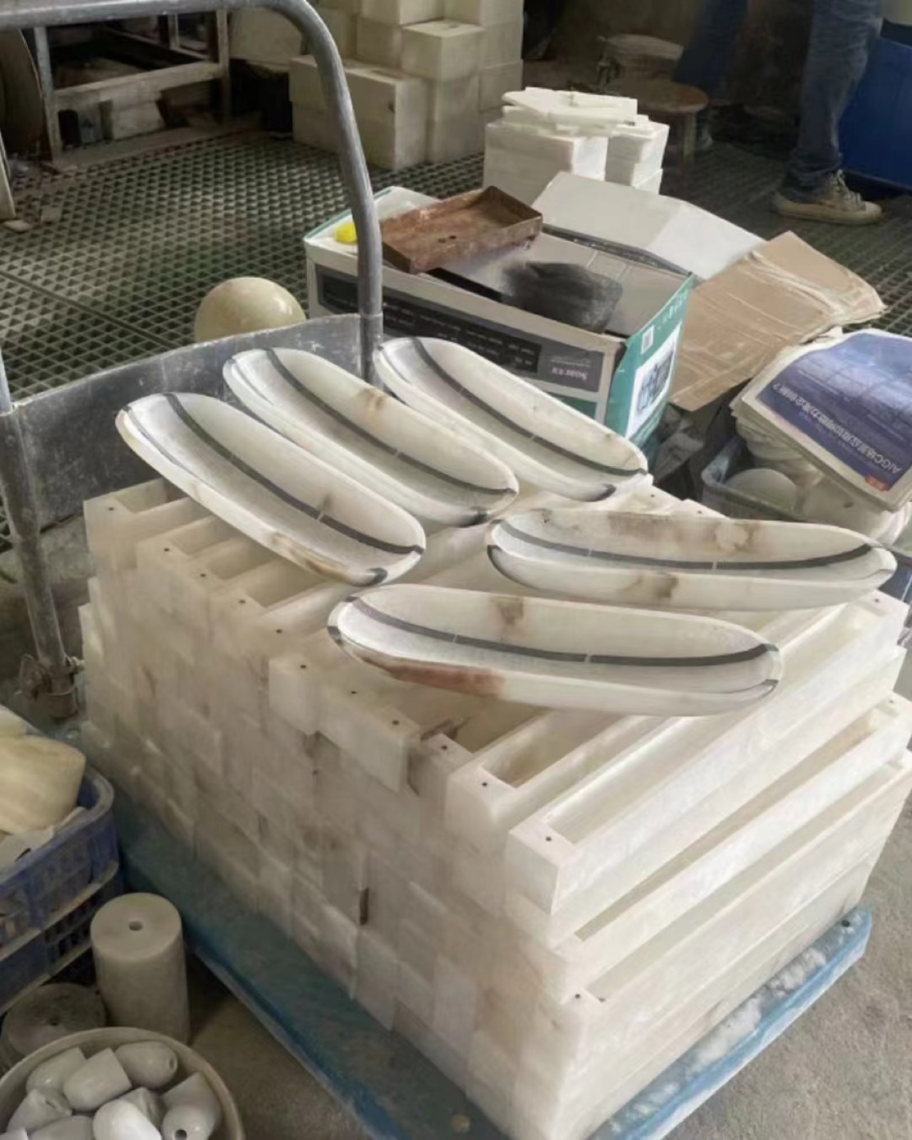 Natural stone lighting components during shaping and preparation in the workshop.